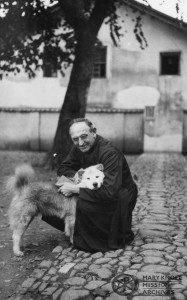 Fr Downs with his dog, Meixien, China, 1935