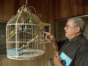 Fr Ted Custer with his parrot