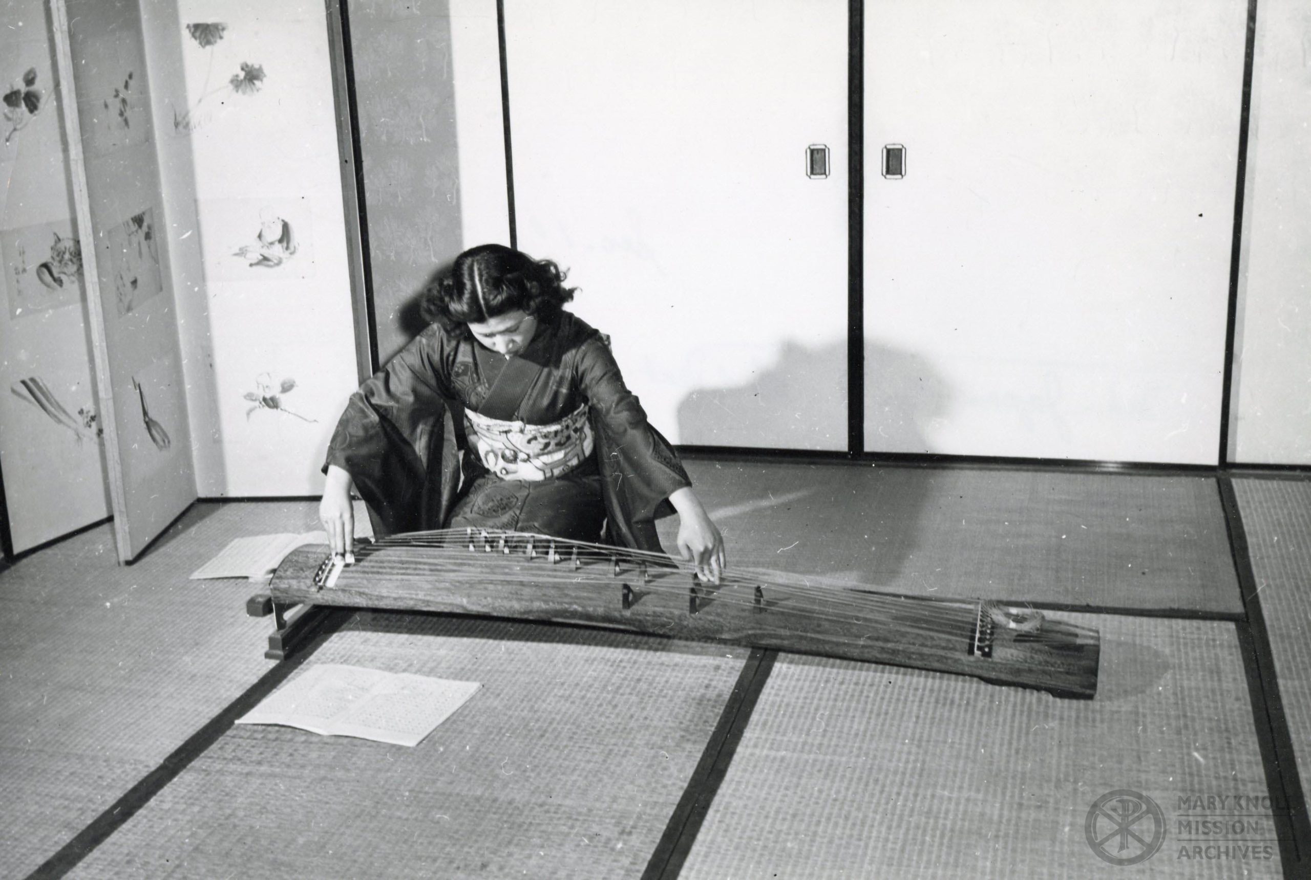 Woman with string instrument, Japan
