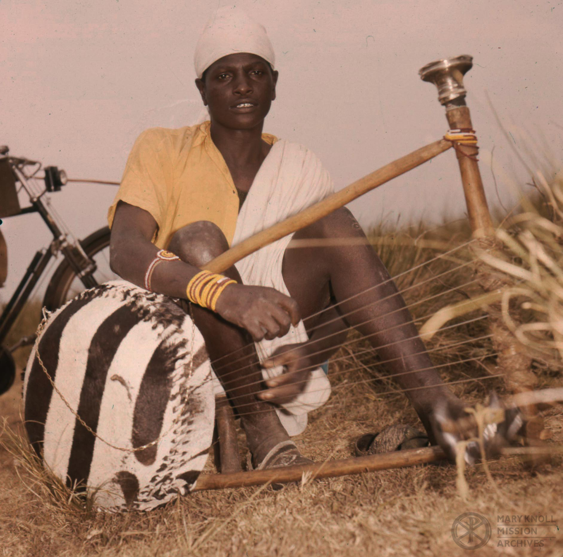 Man with string instrument, Tanzania