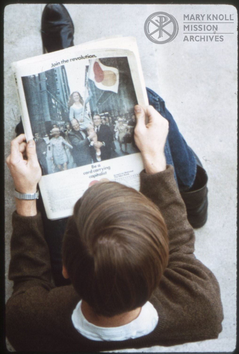 Glen Ellyn Student reading a newspaper