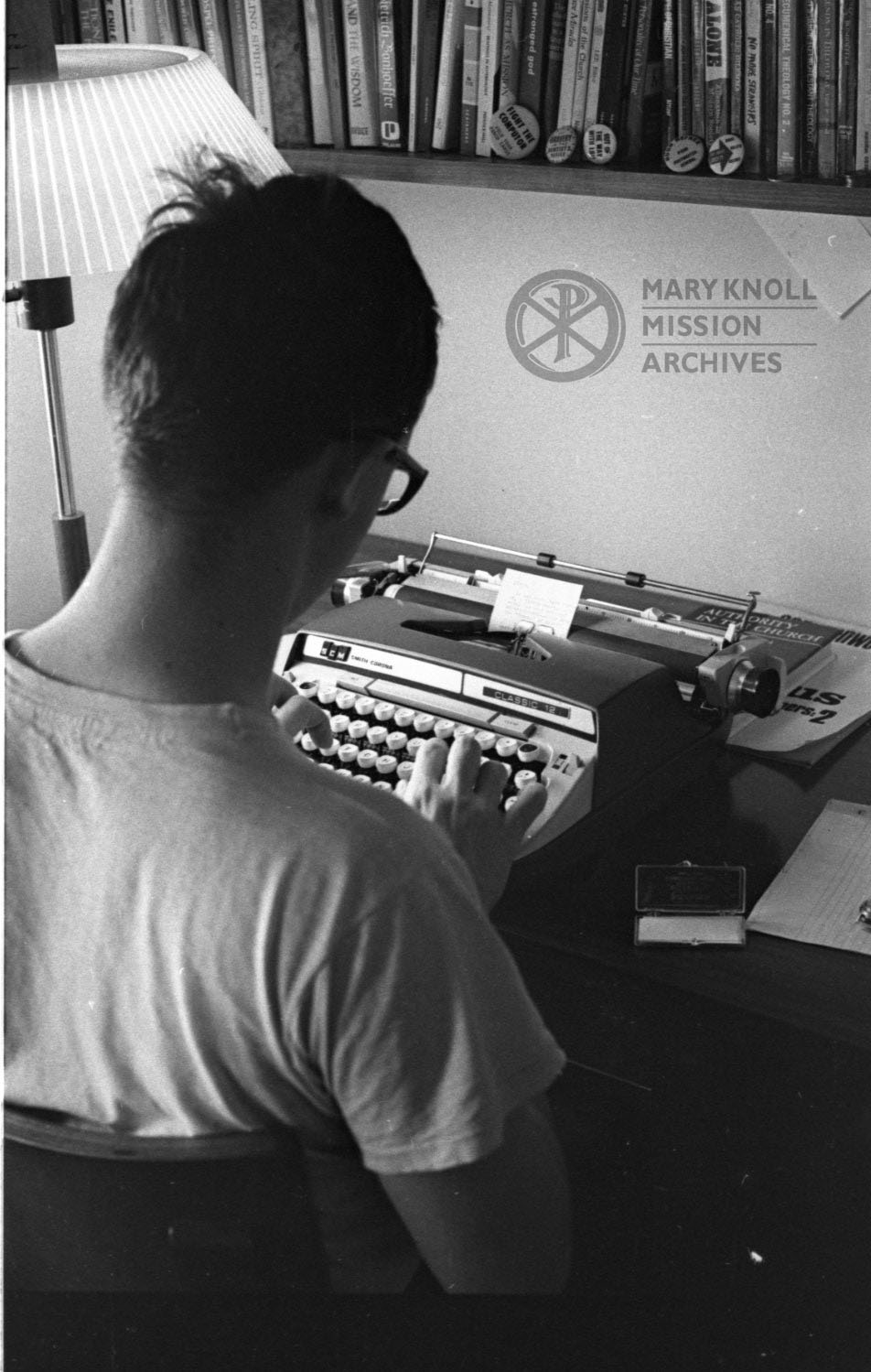 Glen Ellyn Student on his typewriter