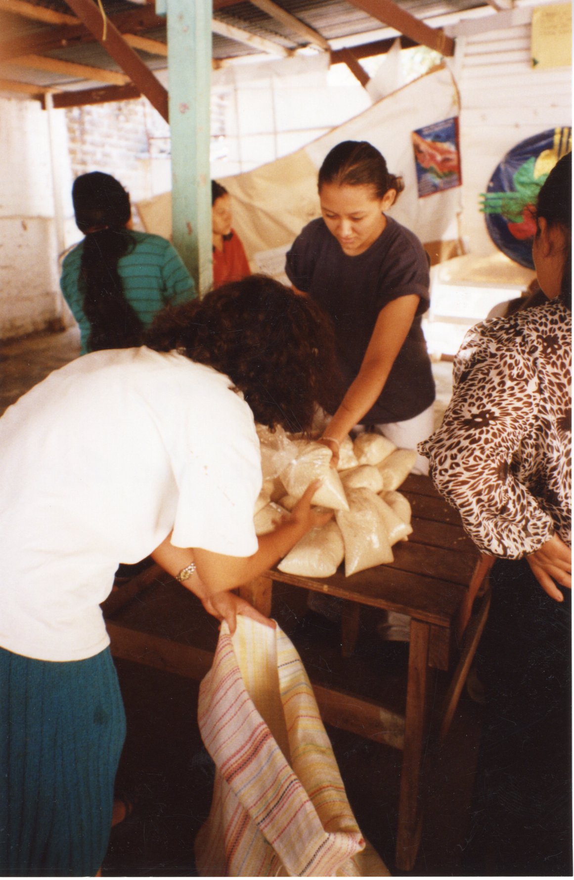 Relief workers packaging Rice for Earthquake victims, 2001