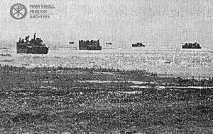 Photograph of Amtracs departing the Beachhead, 1945