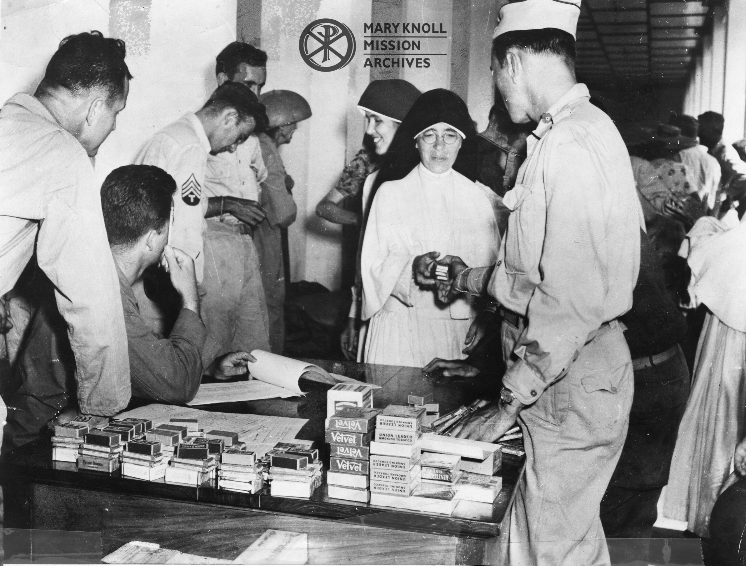 Maryknoll Sister receiving Candy Bars from the Red Cross, 1945