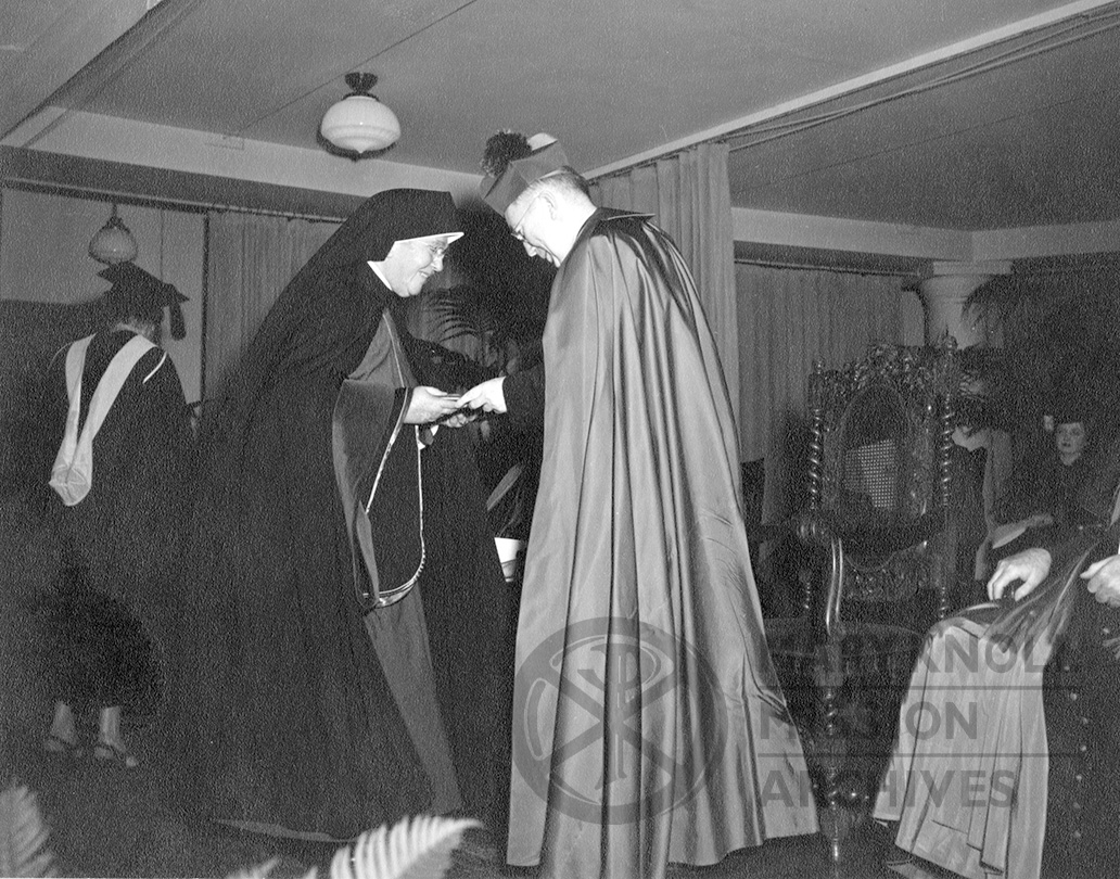 Archbishop O'Boyle presents Mother Mary Joseph Rogers with her honorary degree from Trinity College, 1949