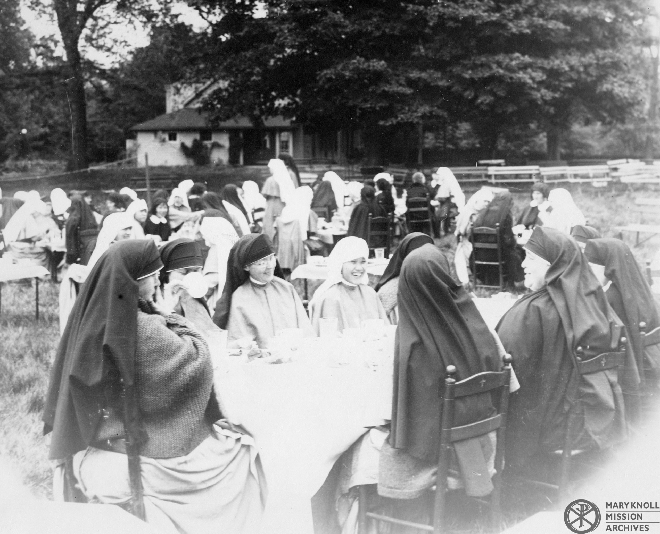 Maryknoll Sisters Eating Outside Together