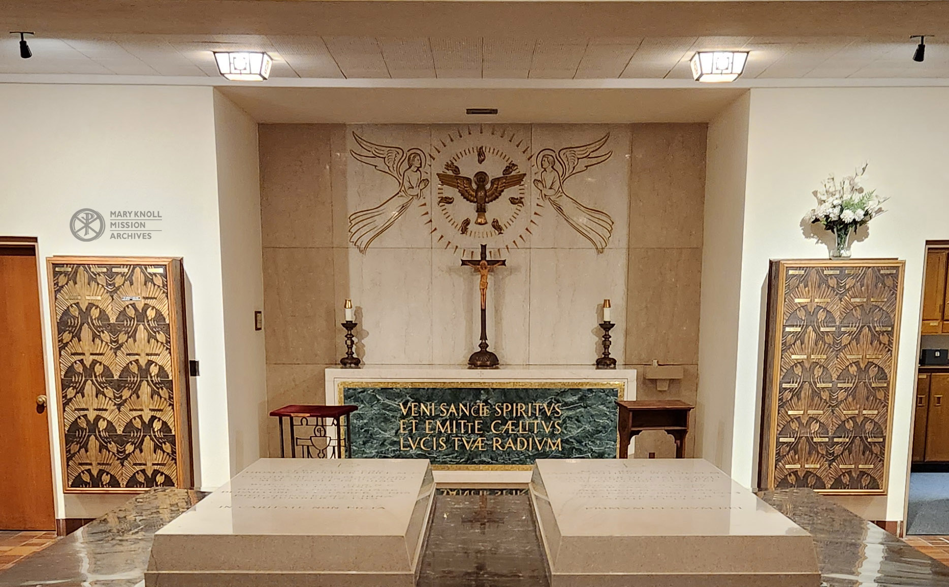 The Holy Spirit Alter flanked by two columbariums. The headstones of Fr. Thomas F. Price and Bp. James A. Walsh can also be seen here. 
