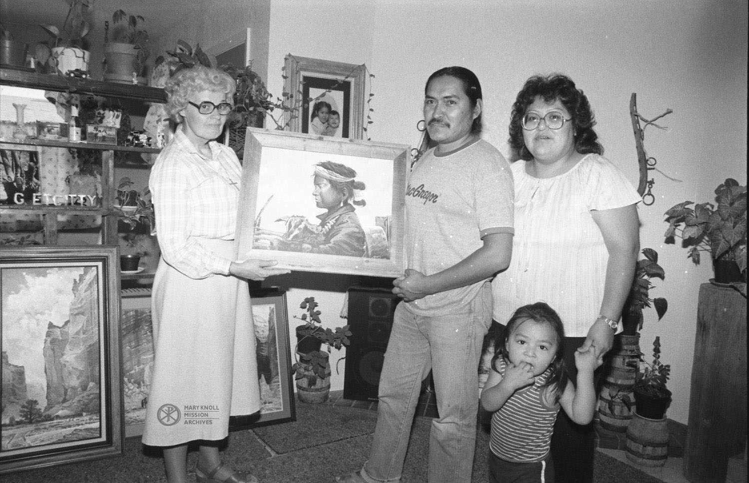 Sr. Carolyn B. MacDonald poses with a Navajo family in their home, Waterflow, New Mexico, 1984