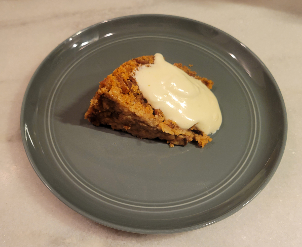 Slice of Thanksgiving Pudding with Yellow Sauce
