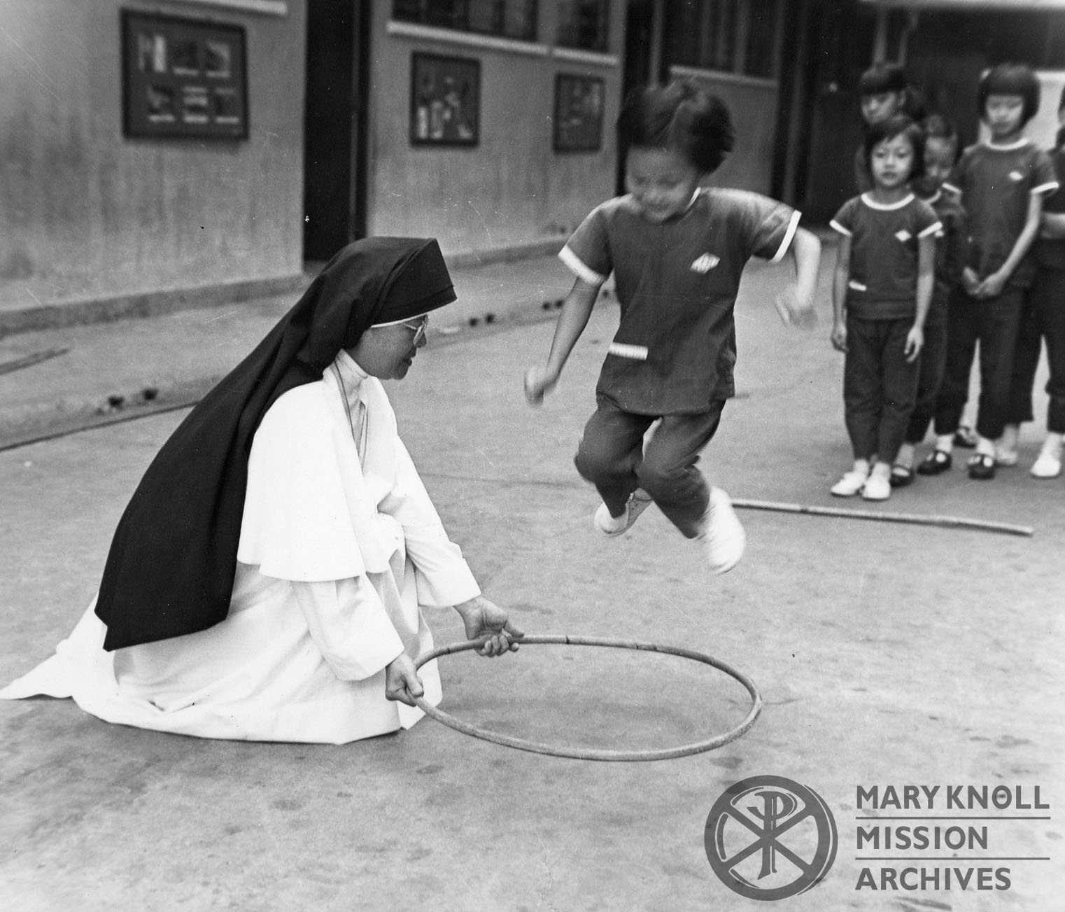 Jung_SrChristineMarie_Chicago_Chinatown_watermark Sr. Christine Marie Jung playing with children in Chinatown, Chicago