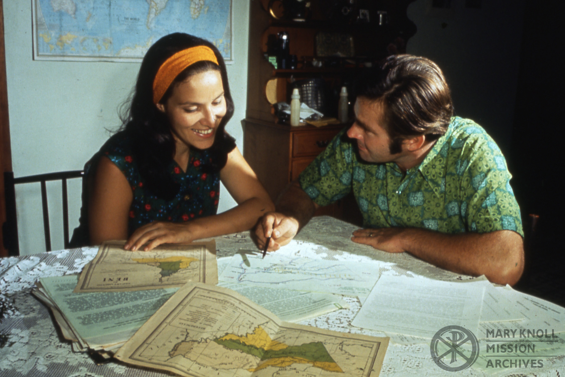 Honerkamp_CarolJoe_Bolivia_003_watermark Former Lay Missioners Carol and Joe Honerkamp reviewing maps of the Beni Region, Bolivia.