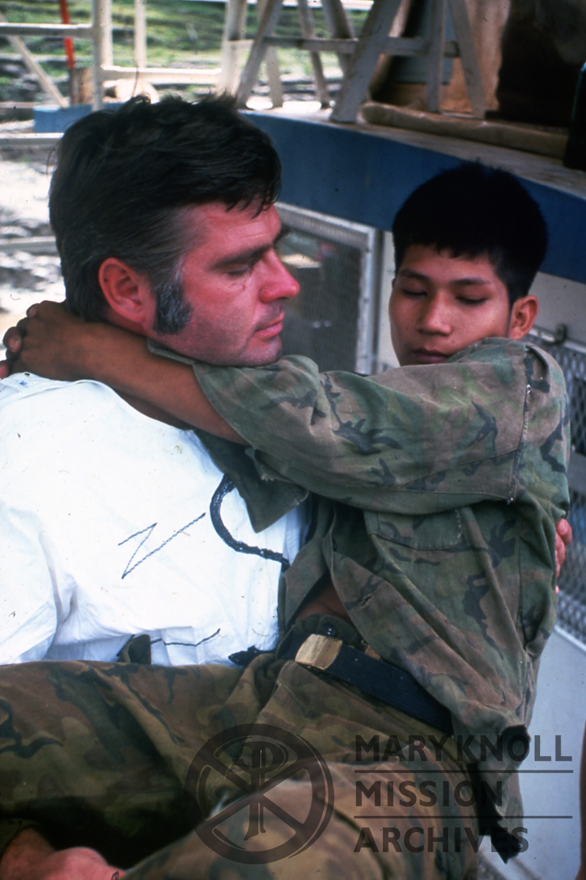 Honerkamp_Joseph_Bolivia_Wheater_002_watermark Former Lay Missioner Joe Honerkamp carrying a patient, Bolivia.
